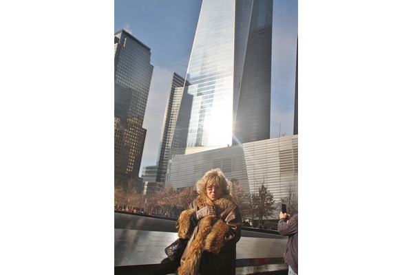 Mrs. Crociani at the Ground Zero Memorial, in front of the Freedom Tower